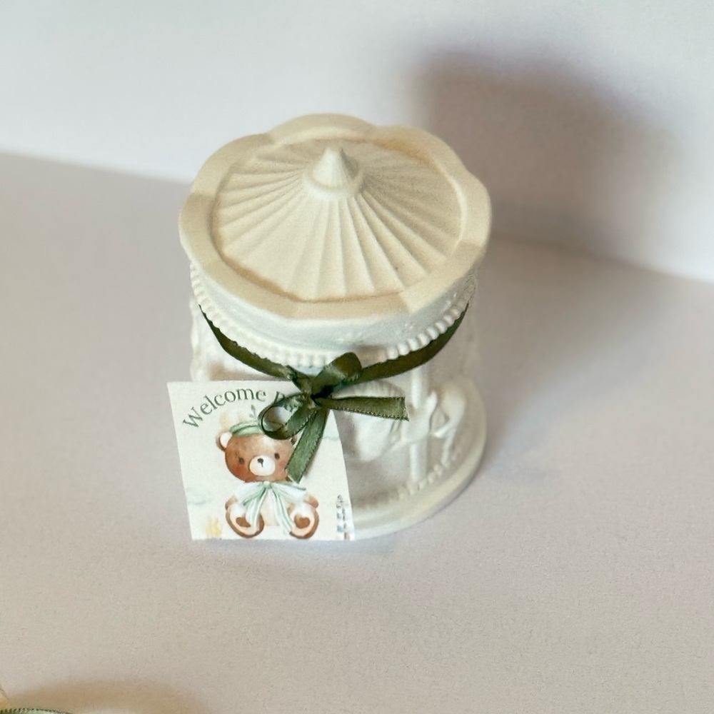 White Ceramic Carousel with Green Ribbon